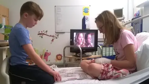 Janine Price Bex Price with her brother Sam in Great Ormond Street Hospital