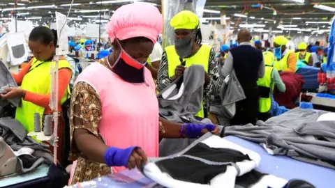 Getty Images Women in a garment factory