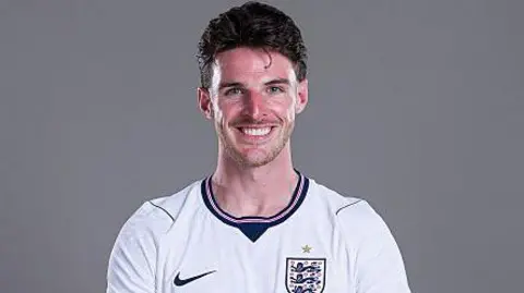 Declan Rice in an England shirt with a sunburned face