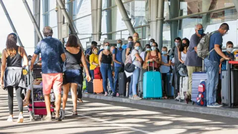 Getty Images Passengers at an airport
