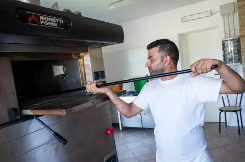 Marco Panzetti Raja bakes bread