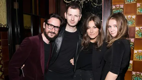 Getty Images Anna Sorokin (right), then known as Anna Delvey, at a fashion event at a New York hotel in 2014