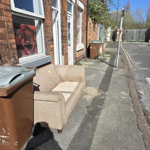 Jessica Stratton/LDRS Sofa outside property on residential street