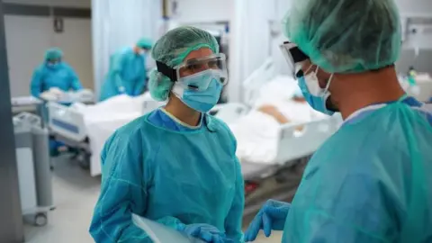 Getty Images Picture of healthcare staff in intensive care