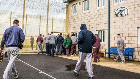 Getty Images Prisoners leaving to go to work