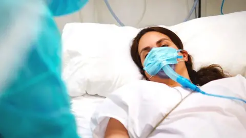 Getty Images Woman in hospital bed