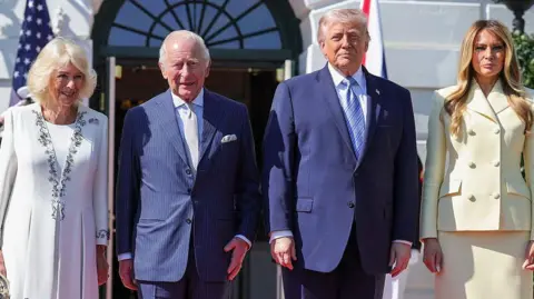 Getty Images US President Donald Trump and first lady Melania Trump stand with Queen Camilla and King Charles III on the South Lawn of the White House.