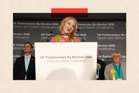 EPA/ Shutterstock Green Party winning candidate Hannah Spencer delivers a speech after the vote count for the Gorton and Denton by-election