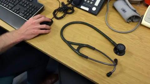 BBC Stethoscope sat on stack of files