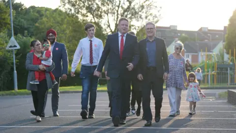 Jacob King/PA Wire Labour Party leader Sir Keir Starmer (right) with local parliamentary candidate Chris Bloore arriving for a visit to Redditch, Worcestershire, while on the general election campaign trail in 2024.