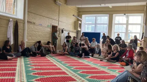 STAND UP TO RACISM Demonstrators inside Hastings Mosque on Sunday