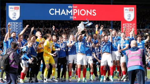 Portsmouth FC with League One trophy.