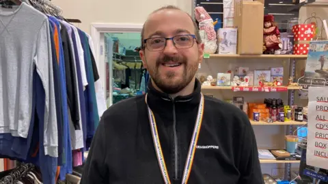 Bangor University Paul Taylor at British Heart Foundation shop in Bangor