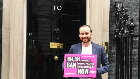 Greenpeace A man standing in front of No.10 Downing Street