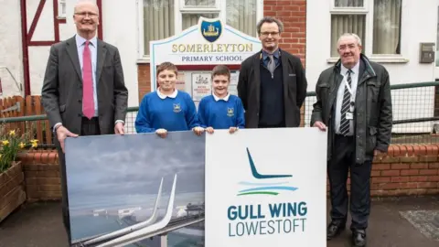 Suffolk County Council Somerleyton Primary School pupils Jack and Hayden with Suffolk County Council leader Matthew Hicks (far left), Waveney MP Peter Aldous (second right) and East Suffolk Council\\'s transport cabinet member Norman Brooks