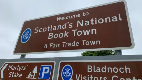 Image of road sign saying 'Scotland's National book town'