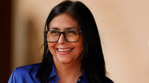 Reuters Venezuela's interim president Delcy Rodriguez smiles during a press conference