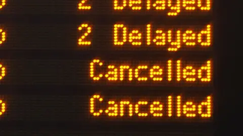 Railway information board listing cancelled services