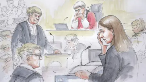 Helen Tipper Court drawing showing Lucy Letby (wiping tear away) whilst giving evidence at Manchester Crown Court. Her defence counsel Ben Myers KC (left) is also seen in this courtroom sketch, as is presiding Judge Justice Goss (Mr Justice James Goss). Image date: May 2nd 2023. copyright Helen Tipper for BBC News