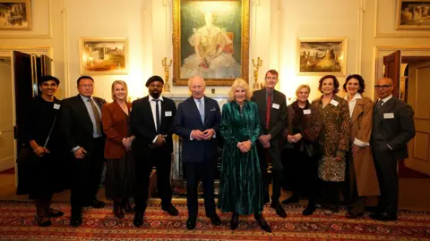 PA Media King Charles III and Queen Camilla with Reeta Chakrabarti, Tan Twan Eng, Sir Ben Okri, Lee Child, Selina Cadell, Sigourney Weaver, Felicity Blunt and Stanley Tucci during a reception for authors, members of the literary community and representatives from the Queen's Reading Room, at Clarence House, London, to celebrate the first recipients of the Queen's Reading Room Medal