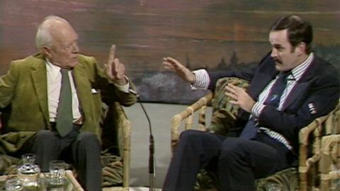Malcolm Muggeridge and John Cleese debate in the studio.