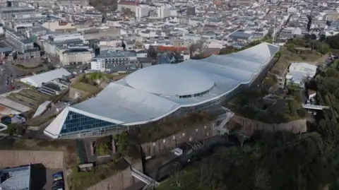 A drone shot of fort regent with the dome part of the building in the centre