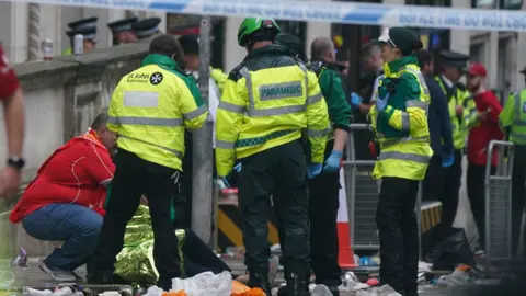Paramedics surround injured people after Water Street incident