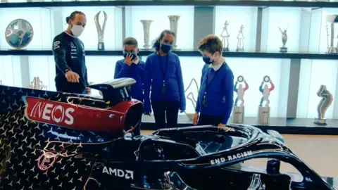 UBS Lewis Hamilton with the school pupils