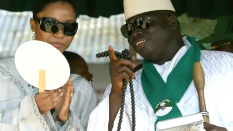 AFP Gambia's then President Yahya Jammeh and his wife pictured on the campaign trail in September 2006