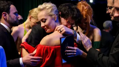 Getty Images Daniel Roher and Yulia Navalnaya, backstage at the 2023 Oscars