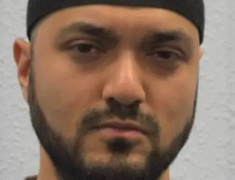 Met Police Mugshot of Mohiussunnath Chowdhury shown during the trial at Woolwich Crown Court, London, Wednesday, 22 January 2020