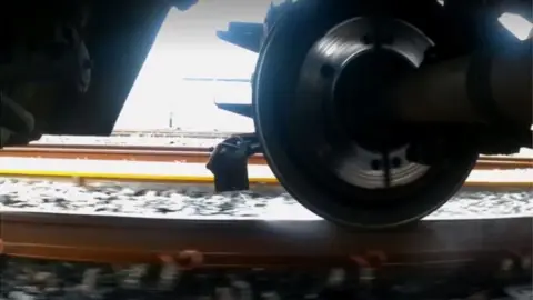 Northern Water being sprayed onto line from train