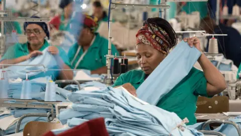 Getty Images Worker in a garment factory in Cape Town, South Africa