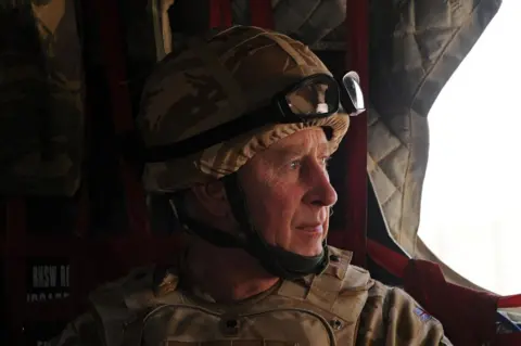 PA Prince of Wales in a British military helicopter over Afghanistan