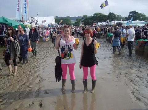 Zoe Ayla Davignon Two women wearing wellington boots standing in mud