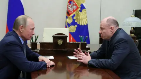 Getty Images Vladimir Putin and Vladimir Potanin at a meeting in 2017