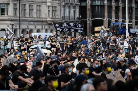 Getty Images Pro-democracy demonstrators gather at Parliament square in London to mark the third anniversary of the start of massive pro-democracy protests which roiled Hong Kong in 2019 Organisers claimed about four thousands attended the rally.