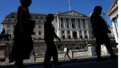 Getty Images Bank of England with people in front