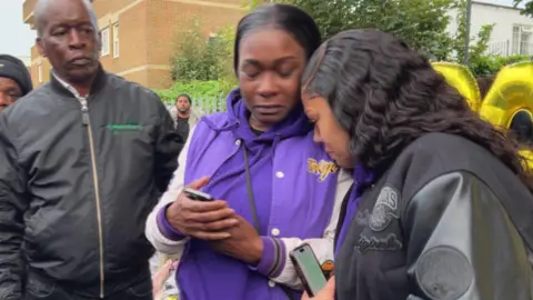 Daejaun Campbell's mother Jodie Taylor visibly upset and grieving with family 