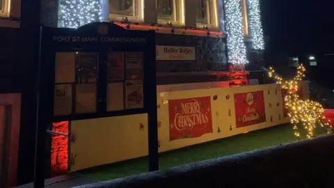 EMMA DRAPER/LDRS The outside of Port St Mary Town Hall, which is decorated in festive lights.