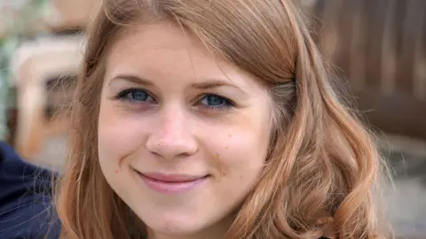 A photograph of Sarah Everard smiling