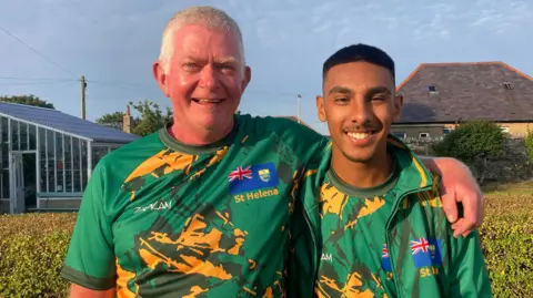 Alice Cant Andy Cant and Tyler Anthony wearing the yellow and green St Helena athlete kit