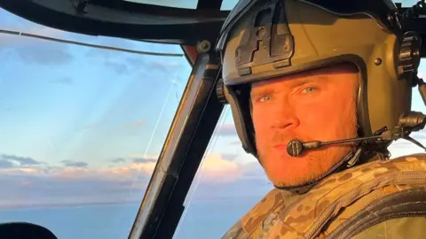 Ministry of Defence Lt Rhodri Leyshon in an aircraft