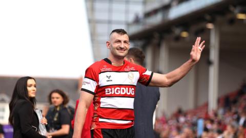 Jonny May waves to the crowd at the end of his final game for Gloucester