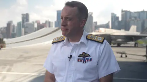 BBC Commodore James Blackmore, commander of the UK carrier strike group, on board the HMS Prince of Wales which it was docked in Singapore