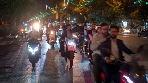 Getty Images Supporters of Iranian presidential candidate Mohammad Baqer Qalibaf ride motorbikes on Tehran's Revolution Avenue