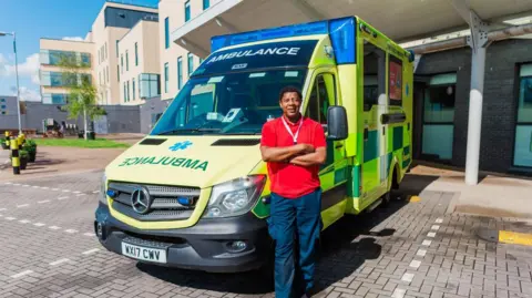 Kian Swainston A parademic standing beside an ambulance outside Southmead Hospital's Brunel building