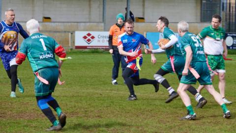 Group playing tag rugby in Bath