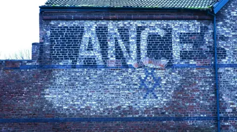 York Ghost Signs Project Brick wall that says Lance in white letters