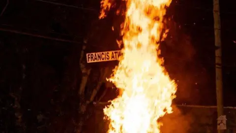 Francis Atwoli Road sign burning